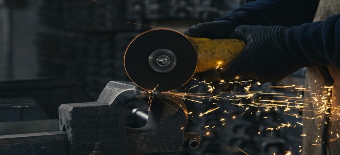 Industrial grinders on workshop bench – angle grinders, bench grinders and power tools supplied by Jones & Clark